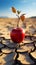 Desert scene apple on cracked earth signifies food insecurity, water shortage, agricultural crisis