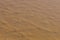 Desert seen from plane. Aerial view of red sand with textures.