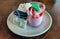 Desert shot of cakes and fruit yogurt parfait on a white plate background