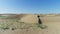 Desert in the spring. Dunes with rare grass. Filmed by drone