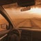 Desert Storm Encounter: Through the Dusty Windshield of a Car