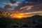 desert sunrise, with the sun breaking through the clouds in a glorious display of color