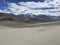 Desert surrounded by mountains.