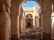 Desert town of Mhamid, Morocco village with sand dunes and old muslim mosque in north Africa, old narrow streets, traditional clay