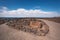 Desert volcanic landscape with rusty sign in Los Hervideros, Lanzarote, Canary islands, Spain.