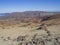 Desert volcanic landscape on Tenerife with purple mountains in e