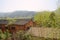 Deserted 1970s` red brick workshops in woods of mountain