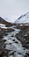 Deserted Area Stream: Snow Covered Mountains In 8k Resolution