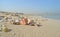 Deserted beach in Dubai with Burj Al Arab in the background and many shells United Arab Emirates
