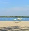 Deserted beach. Several beach umbrellas. Rest on the river.