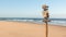 The deserted beach, sky, sea and sand with country signs