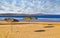 Deserted beach and umbrellas.