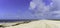 A deserted beach with white, blue water and blue sky at Rutherford Beach, Cameron Parish, Louisiana