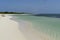 Deserted Caribbean beach with blue sky