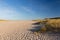 Deserted endless beach between some dunes