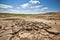 a deserted, eroded landscape caused by severe drought