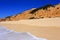 Deserted golden sandy beach in Olhos de Agua, Albufeira, Algarve, Portugal.