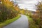 Deserted Lakeside Paved Path in Autumn