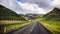 Deserted mountain road in Iceland on a cloudy summer evening