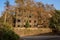 Deserted multi-storied brick building of 1970s in sunny winter afternoon