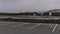 Deserted parking lot of closed tourist resort Blue Lagoon during the Covid-19 pandemic on cloudy winter day.