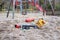 Deserted playground in a city park with broken kids toys during COVID-19 lockdown