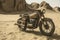 Deserted Rusty Motorcycle in the Sand