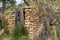 Deserted sand stone house rock wall abandoned