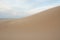 Deserted sandy beach with clean fine sand at sunrise