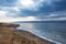 Deserted shore of Dead sea on Jordanian side in off-season, view of Israel, beach is closed during coronavirus infection