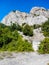 Deserted steep cliffs overgrown with greenery