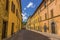 A deserted street at siesta time in the city of Gubbio, Italy