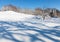 Deserted winter hilly field landscape