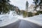 Deserted winter mountain road in the European Alps