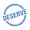 DESERVE text written on blue grungy round stamp