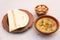 Desi breakfast, haleem, halim, dhaleem, halwa and chapatti served in dish isolated on background top view of bangladesi breakfast