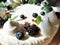 Design cake with white cream and blueberries