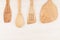 Design concept of mock up of empty wood beige spoons on white wood background.