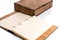 Design concept - Wooden opened notebook with blank pages near wooden box