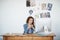 The design looks perfect. a young woman working at her computer in an office.