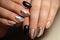 Design manicure black and beige nails with abstraction