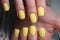 design on yellow manicure