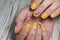 design on yellow manicure