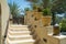 Designed stairs with flowers in jugs at luxury arabic desert resort