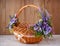 Designer basket is decorated with flowers. Wicker basket for celebrating Easter and other holidays.