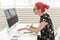 Designer, creative, people concept - red hair woman designer doing a project on a graphic tablet