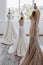 The designer fitted three white dresses in the white room