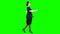 Designer girl comes with a drawing in her hands. Green screen. Side view