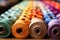 Designers studio filled with colorful fabric rolls - stock photography concepts