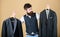 Designing made to measure suit. Custom made suit. Man bearded fashion couturier tailor. Elegant custom outfit. Tailoring
